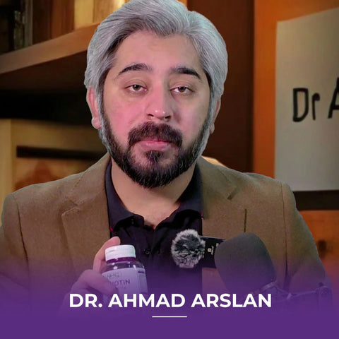 Man in a white coat holding a Vitabiotin 5000 mcg bottle, with text reading “Dr. Ahmad Arslan.”