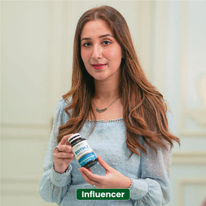 Influencer holding NHC Biotin-Z biotin with zinc supplement bottle