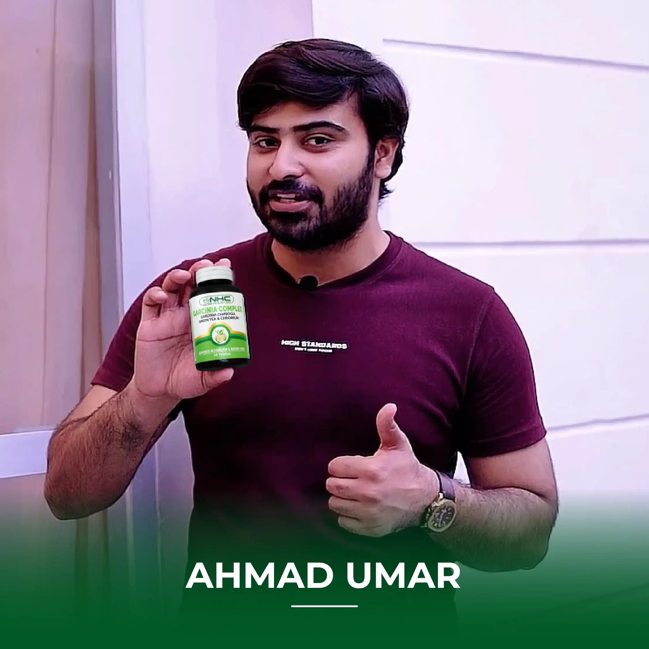 "Ahmad Umar holding NHC Garcinia Complex supplement bottle with thumbs up