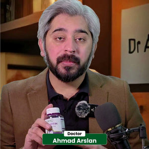 Doctor Ahmad Arslan reviewing NHC VitaBiotin Biotin supplement during podcast with microphone